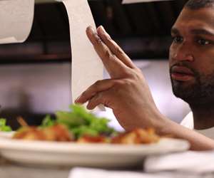 chef on the line checking tickets